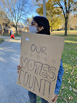 gopal-keerti-with-protest-sign-260px.jpg